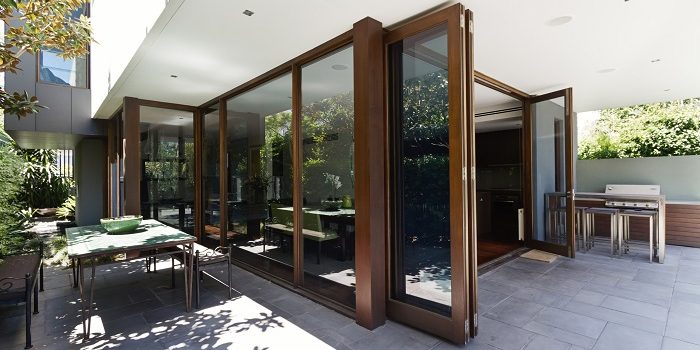 Bi fold doors opening up to rear courtyard of contemporary Australian home
